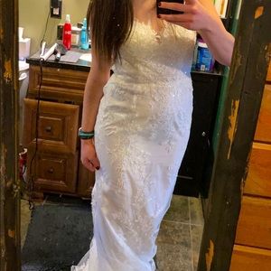 Oleg Cassini buttoned illusion back wedding dress.